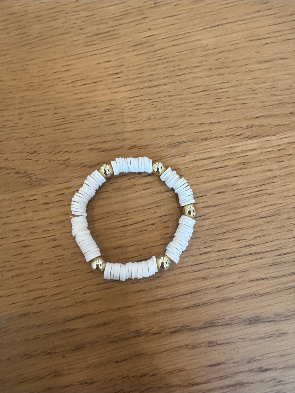 White Heishi Bead Stretch Bracelet with Gold Accents